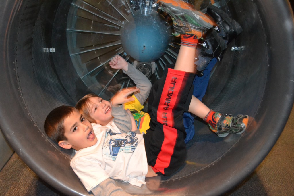 Jack and Luke in an airplane engine.