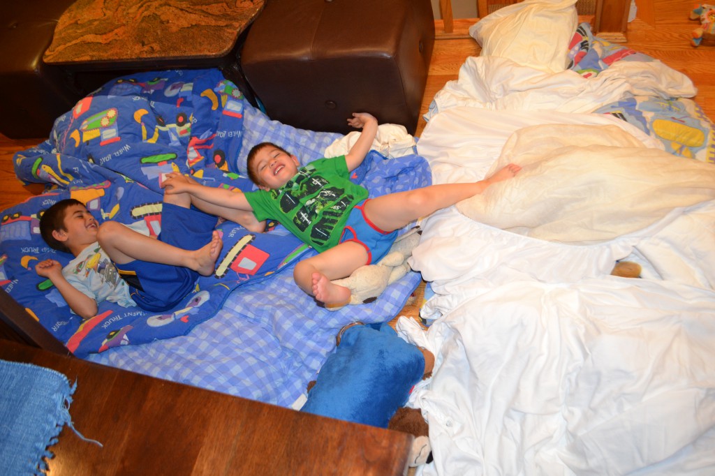 Jack and Ben pulled all their bedding and stuffed animals into the kitchen to make a huge 'nest'.