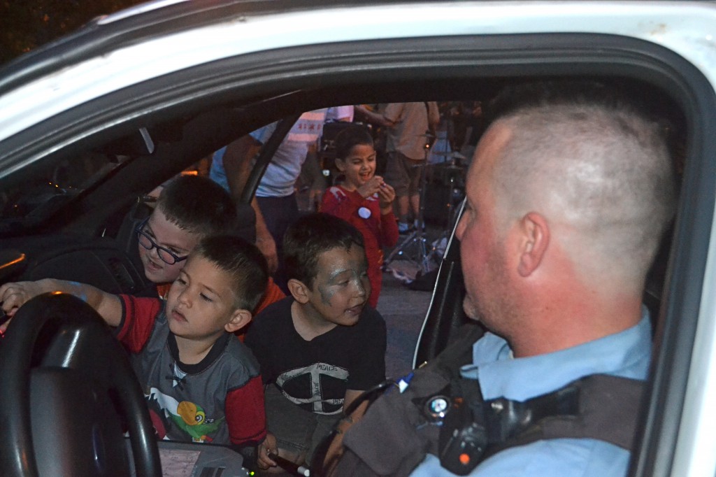 Later on the kids got to push all the buttons in the cop car.
