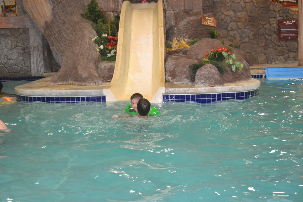 Jack waiting for a scared Sam at the bottom of the slide.