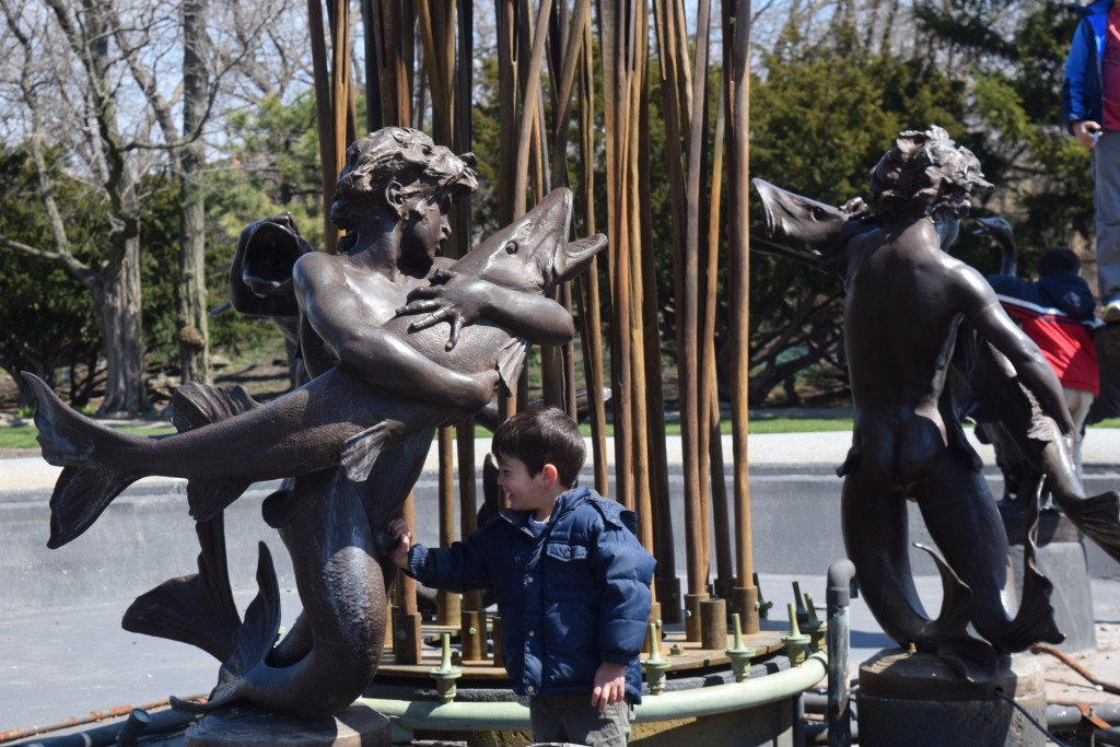 Aaron inappropriately touching the statues and laughing hysterically.
