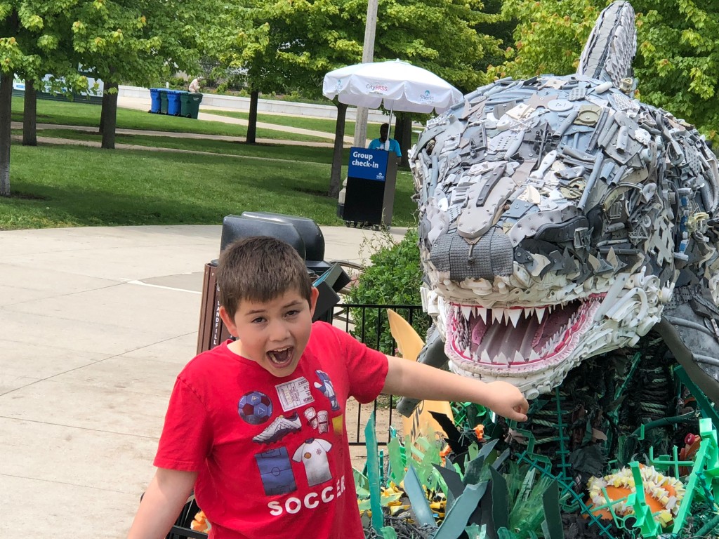 Ben is pretending the shark is eating his arm.