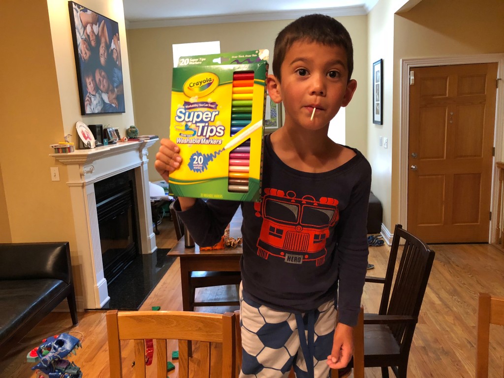 Adam buys Aaron new markers to appease his drawing habit.