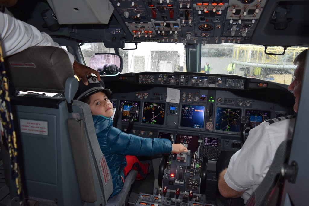 The pilot lets Sam sit in the cockpit