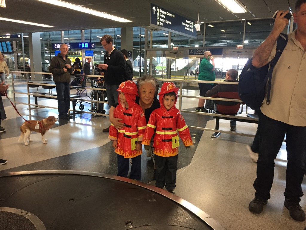 I picked Mom up at the airport with my two firemen escorts.